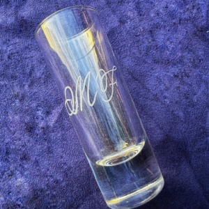 Shot glass engraved "MF"