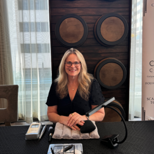 Jill ready in front of whiskey barrels